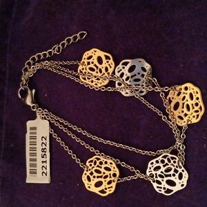 2215822-1.  Three Tier YG & Stainless Bracelet